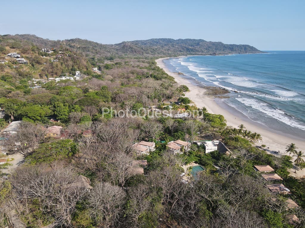 Lush Tropical Beach Paradise with blue water, great waves and rock formations in Malpais / Santa Teresa, Nicoya Peninsula Costa Rica